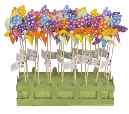 Multicoloured windmilll with white dots on wooden,