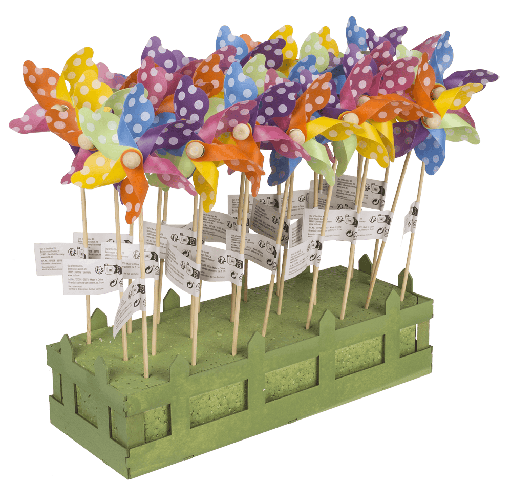 Multicoloured windmilll with white dots on wooden,
