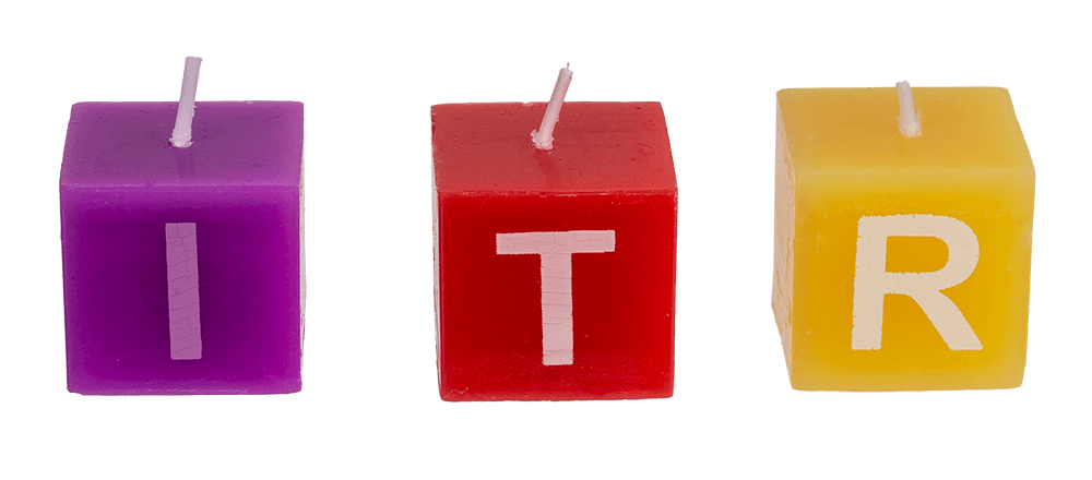 Multi coloured square candles with letters,